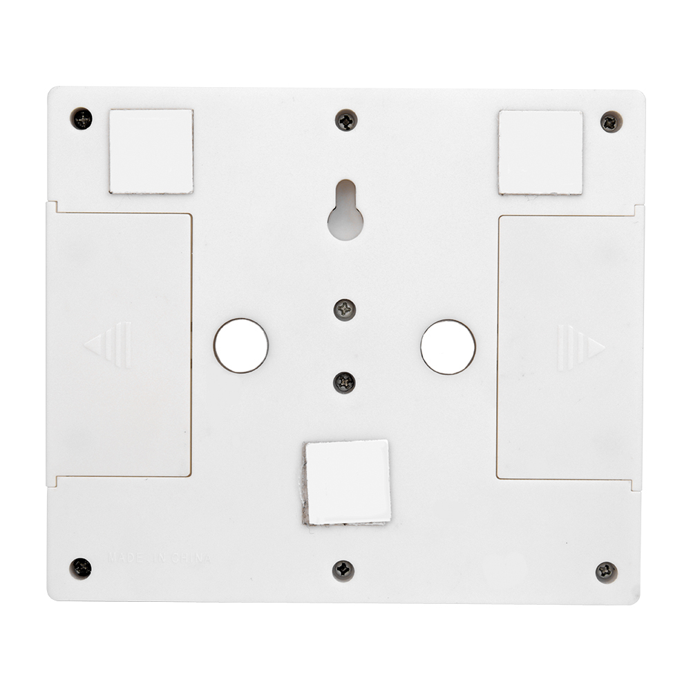 Rear view of the white switch light housing, displaying the flexible mounting hardware including built-in circular magnets, adhesive velcro pads, and a keyhole slot.