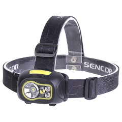 A three-quarter studio view of the head torch showing the curved shape of the black plastic housing, light green accents around the lenses, and the adjustable top-strap configuration.