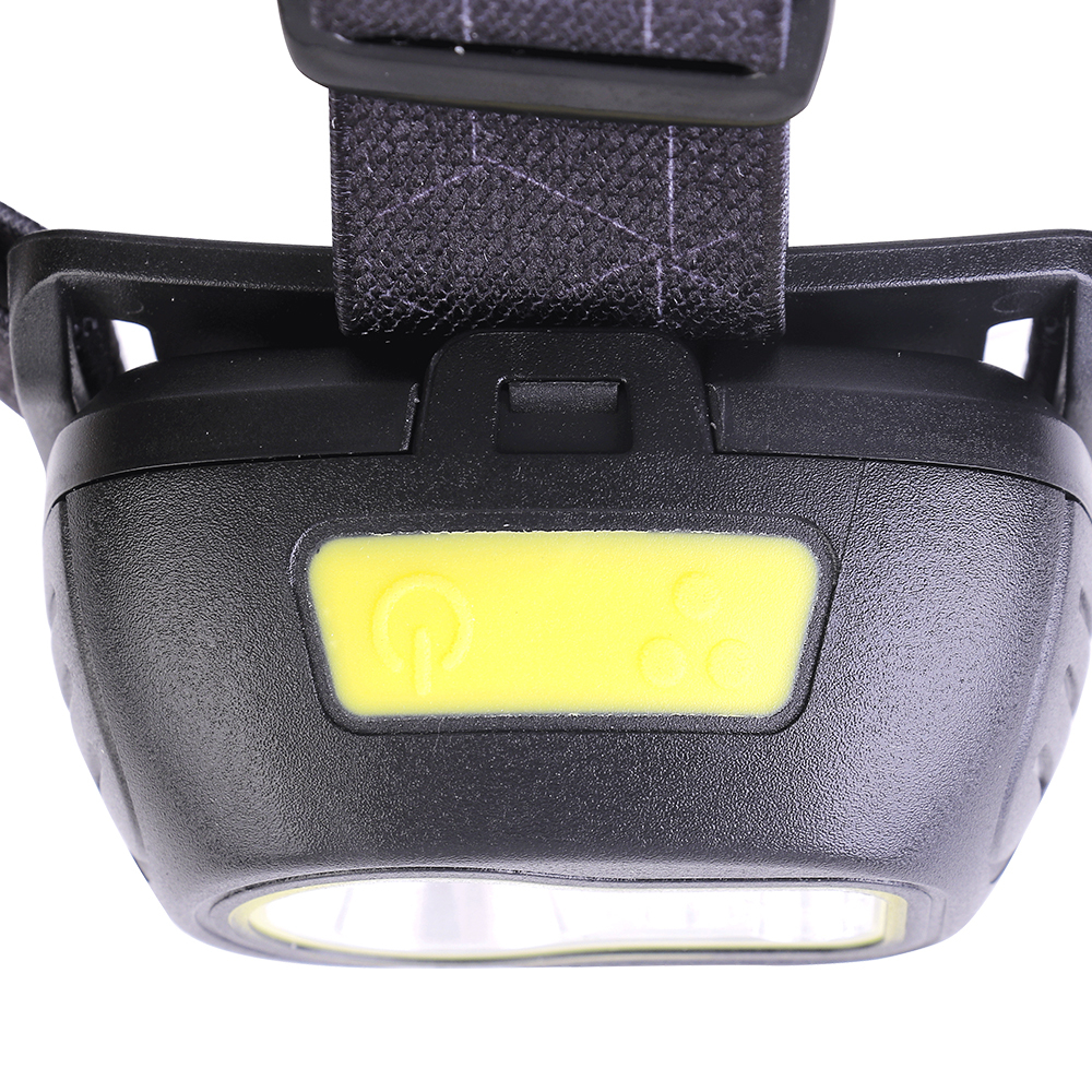 A top-down close-up view focusing on the dual-button control pad integrated into the top casing, featuring two distinct light green rubber push switches for separate mode operation.