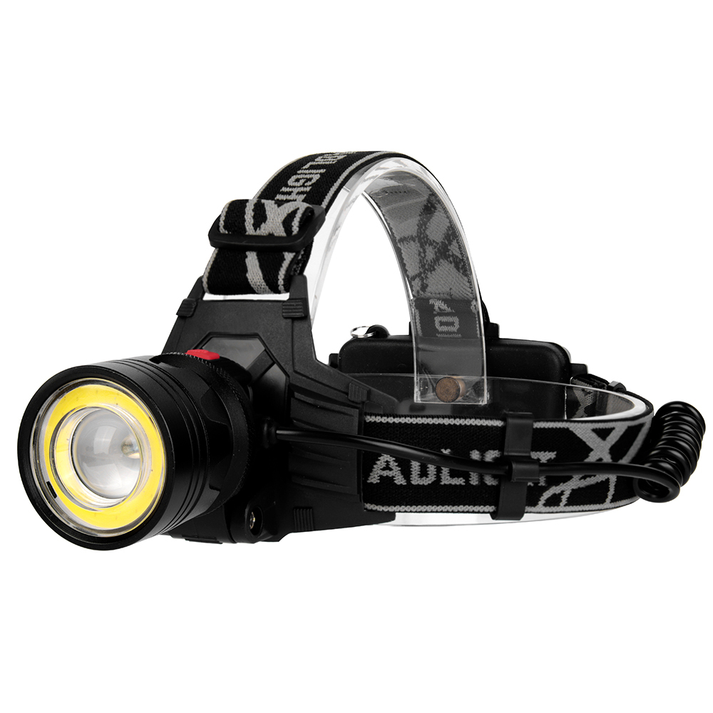 Three-quarter studio view illustrating the complete assembly, highlighting the black coiled power cable connecting the aluminum front light module to the rear battery compartment.