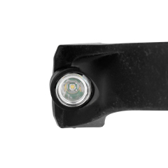 Studio detailed close-up showing the interface between the smooth black silicone body, the round XPE spotlight lens, and the start of the yellow COB LED strip.