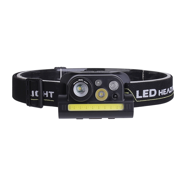 Studio front view of the black multi-LED headlamp on a white background, displaying the spotlight lenses, sensor diodes, and the wide horizontal COB light strip on the main module.