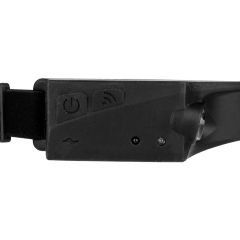 Studio close-up view of the black control housing on the side of the band, showing the power button, wave sensor icon button, and indicator light.