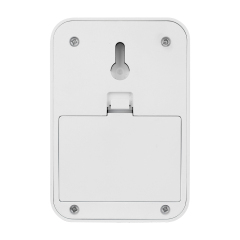 Studio back view of the white switch light housing, displaying the integrated keyhole slot for wall mounting and the closed rectangular battery compartment door.