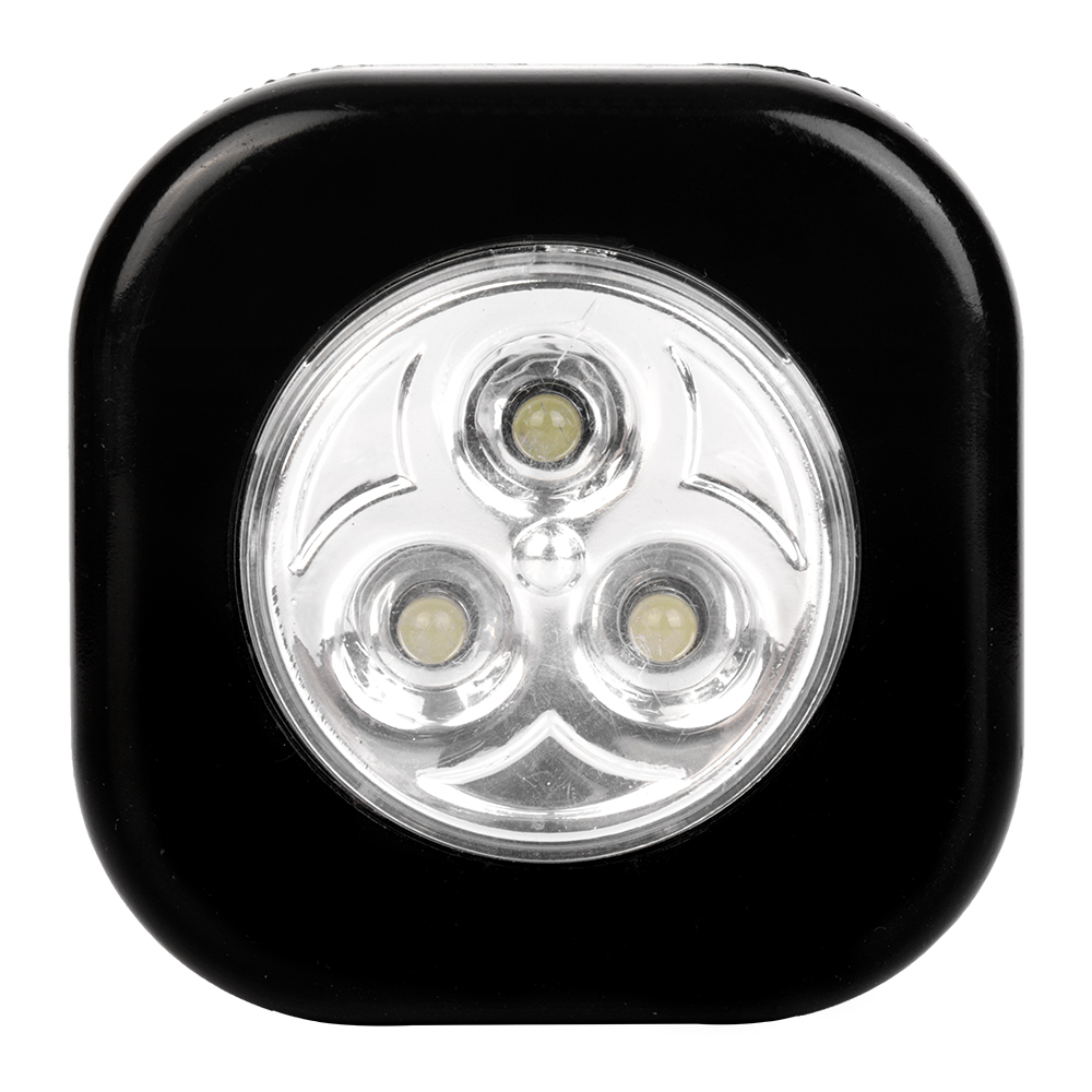 Studio front view of a black rounded-square wireless puck light featuring three integrated LEDs in a circular reflective center.