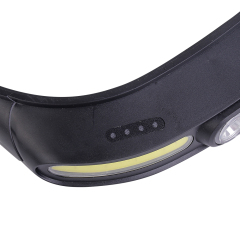Studio close-up view of the top part of the black housing, detailing a series of four small circular LED battery power status indicator lights next to the main light frame.