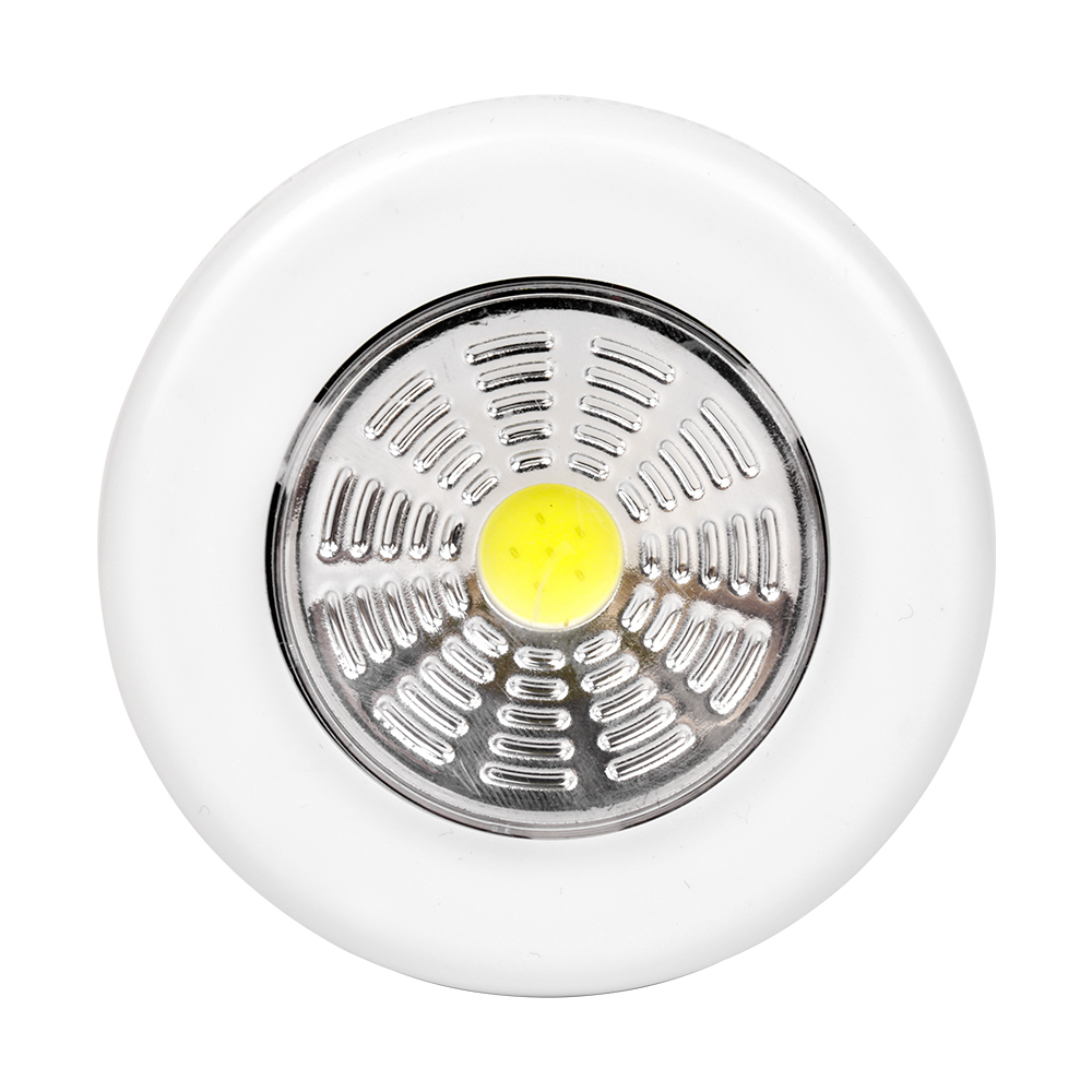 Studio front view of a white round wireless puck light featuring a large circular COB LED panel with a yellow center.