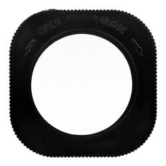 Studio view of the circular black back cover of the cabinet light, showing the open and close markings for twisting the base.