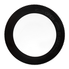 Studio view of the circular black back cover of the cabinet light, showing the open and close markings for twisting the base.