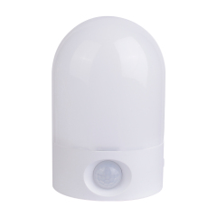 Studio front view of the white arched wireless LED night light, showing the frosted dome cover and the circular PIR motion sensor at the bottom.