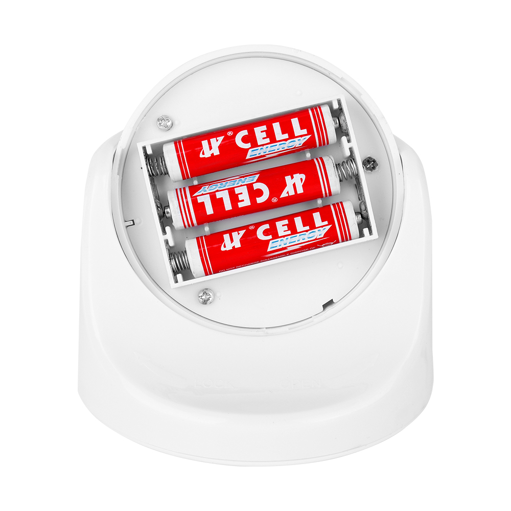 Studio view of the open internal battery compartment inside the unscrewed spherical night light, showing three AAA batteries installed in a row.