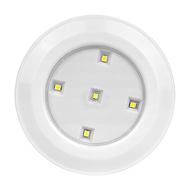 Studio straight front view of the circular LED puck light, featuring five individual small LED diodes arranged symmetrically on a silver reflector plate inside the white housing.