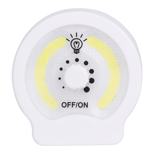 Studio front view of the circular dual COB LED night light, featuring a central rotary dimmer knob with dots for brightness adjustment and OFF/ON labels.