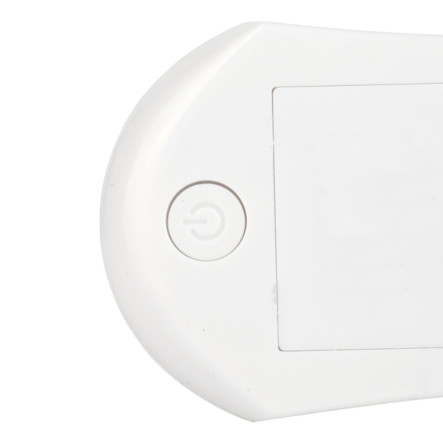 Close-up studio view of the back of the white night light, showing a small debossed circular power button next to the edge.