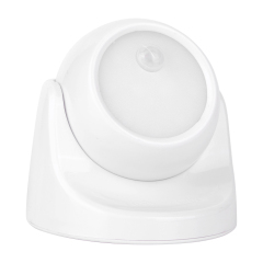 Studio angled front view of the white rotatable spherical LED sensor night light, showcasing the adjustable ball joint casing design.