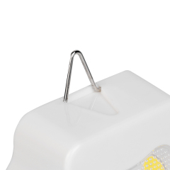 Studio close-up view of the top of the white housing, showing a flip-out triangular metal hook extended for hanging options.