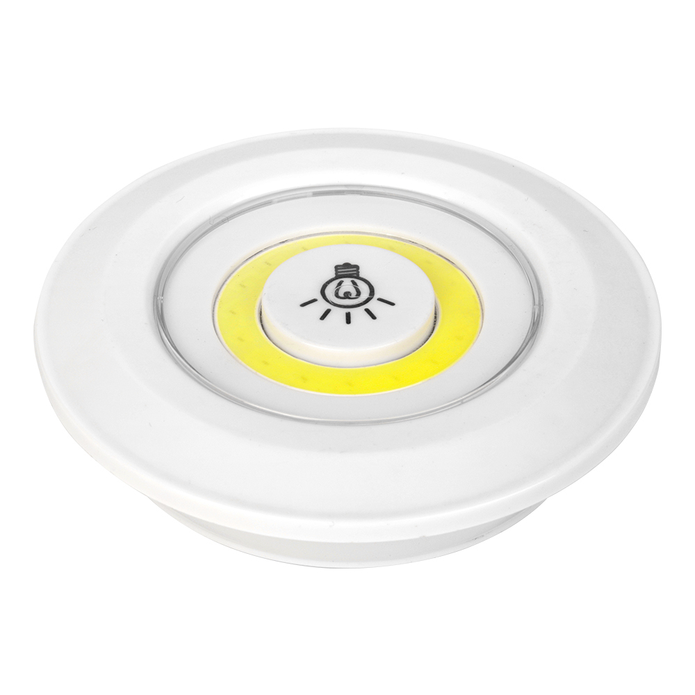 Studio slightly angled front view of the circular wireless COB night light with its yellow light panel and central push switch.