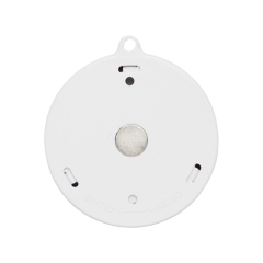 A back view of the round sensor light on a white background, displaying the battery compartment cover, a central mounting magnet, and a hanging loop at the top.