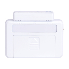 Front view of the white magnetic drawer light with the small contact sensor block placed closely on top.