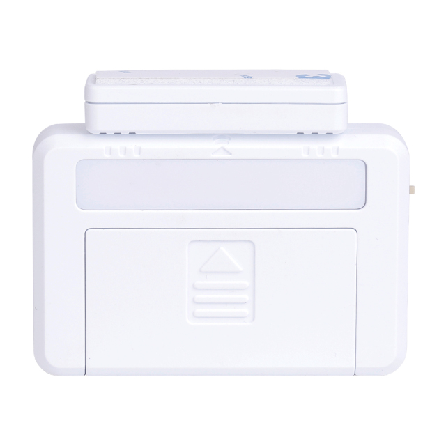 Front view of the white magnetic drawer light with the small contact sensor block placed closely on top.