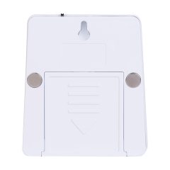 Studio back view of the white night light, showing a built-in keyhole slot for hanging, two round magnets on the sides, and a sliding battery cover.
