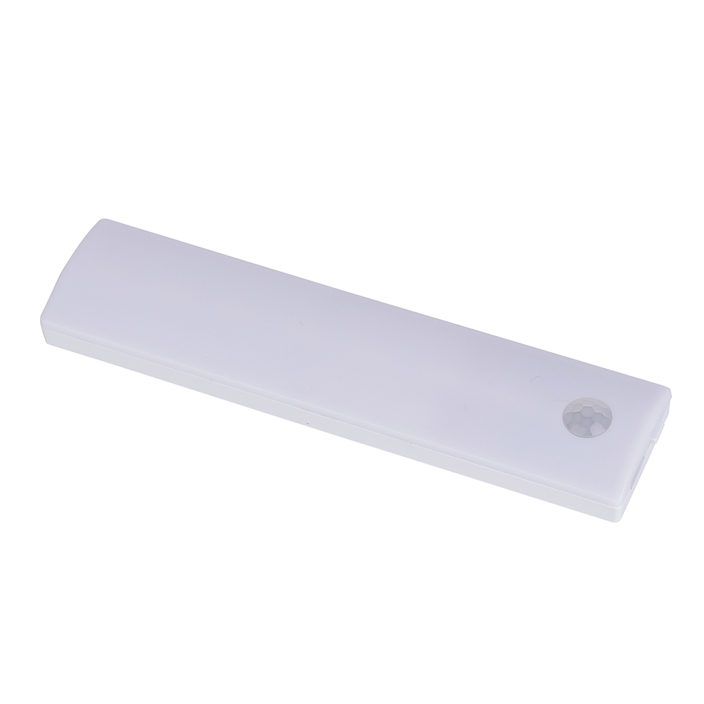 Studio angled view of the shorter white rechargeable LED cabinet light bar, showcasing its clean lines and rounded corner sensor.
