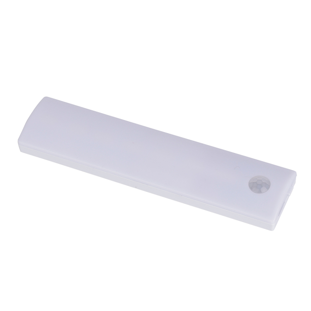 Studio angled view of the shorter white rechargeable LED cabinet light bar, showcasing its clean lines and rounded corner sensor.