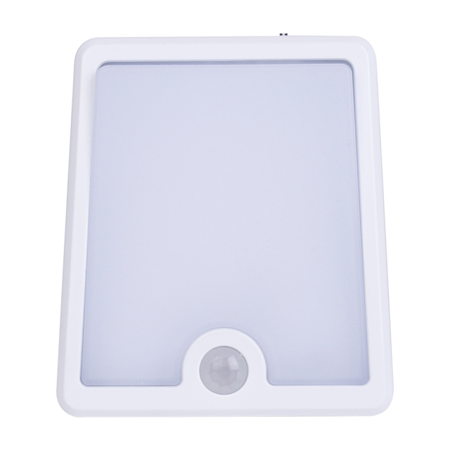 Studio front view of the white square smart LED night light, showcasing its large frosted diffuser panel and a circular PIR motion sensor at the bottom.