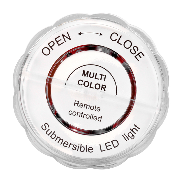 Studio back view of the round submersible LED light casing, featuring printed directional open and close text and arrows for the twist-lock mechanism.