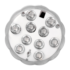 Studio front view of the round submersible LED light, showcasing its transparent scalloped outer shell and white inner plate with an integrated LED array.