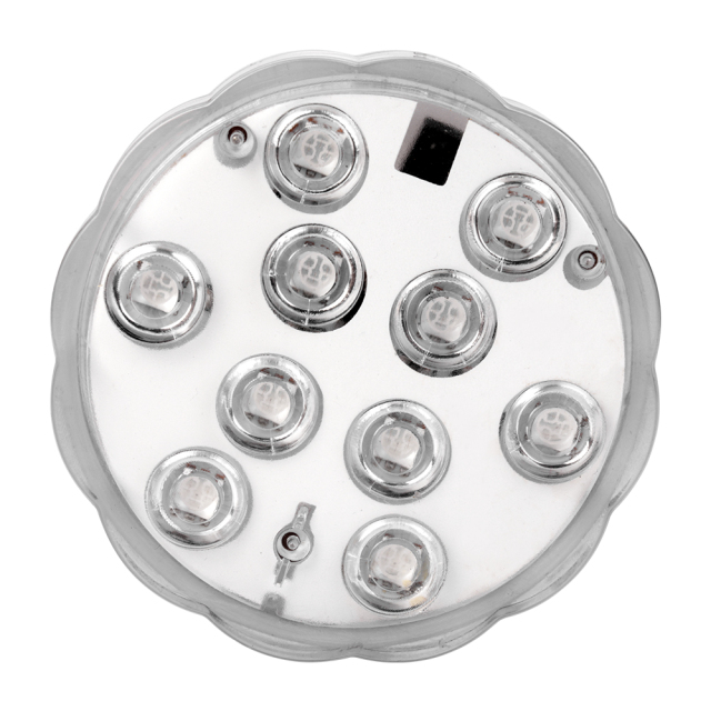 Studio front view of the round submersible LED light, showcasing its transparent scalloped outer shell and white inner plate with an integrated LED array.