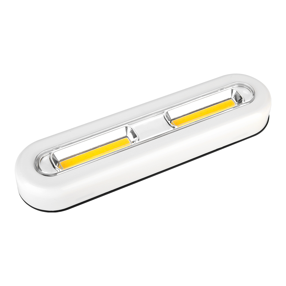 Studio three-quarter angle view of the white oval-shaped wireless COB LED cabinet light bar, displaying its smooth plastic housing and rounded edges.