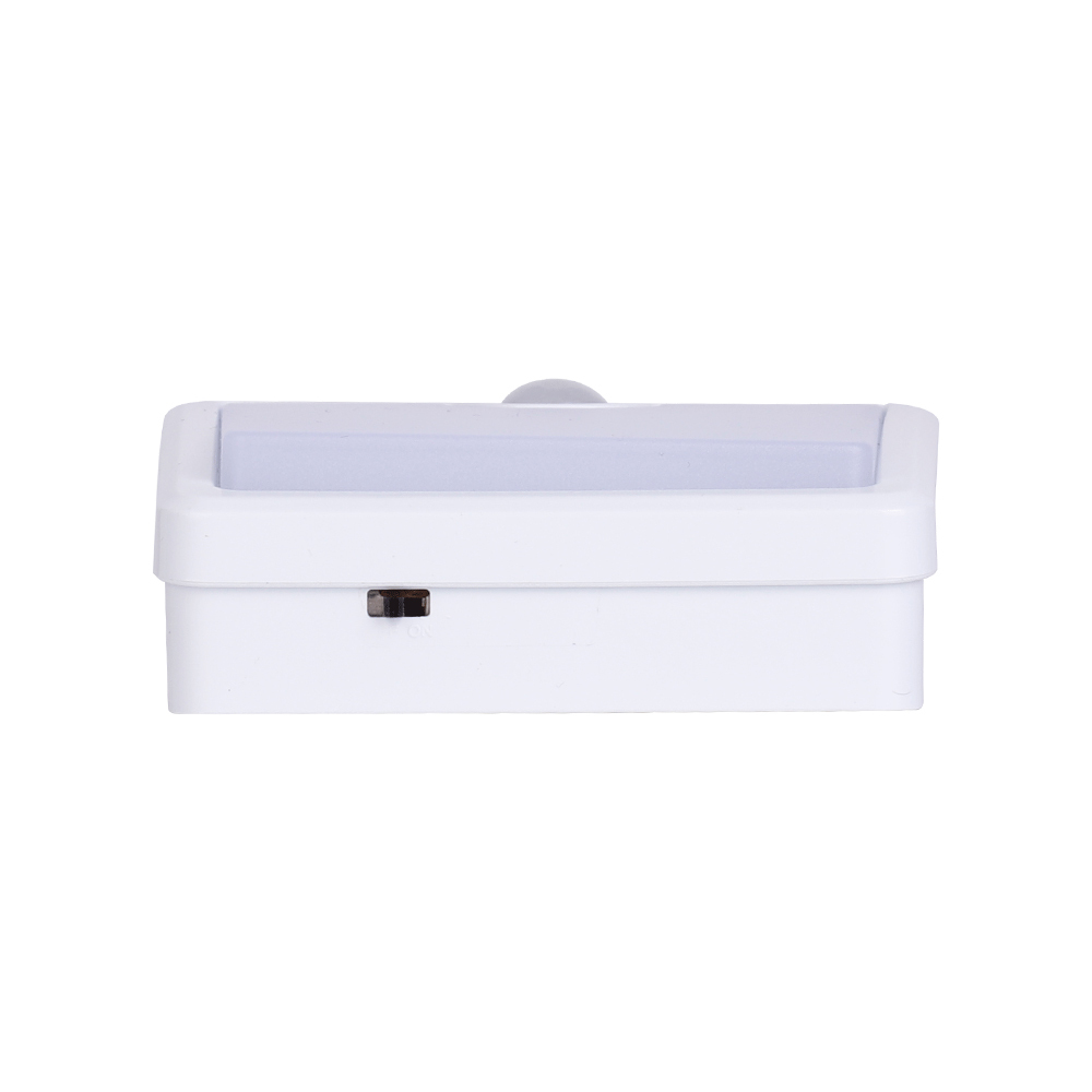 Studio top view of the white LED night light, showcasing the integrated small black toggle switch for power control.