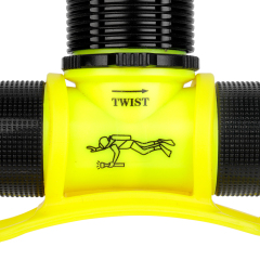 A high-resolution macro shot of the diving headlamp's yellow casing, showing the printed diver logo and directional arrows for the mechanical twist switch.