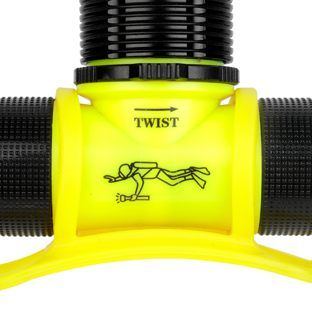 A high-resolution macro shot of the diving headlamp's yellow casing, showing the printed diver logo and directional arrows for the mechanical twist switch.