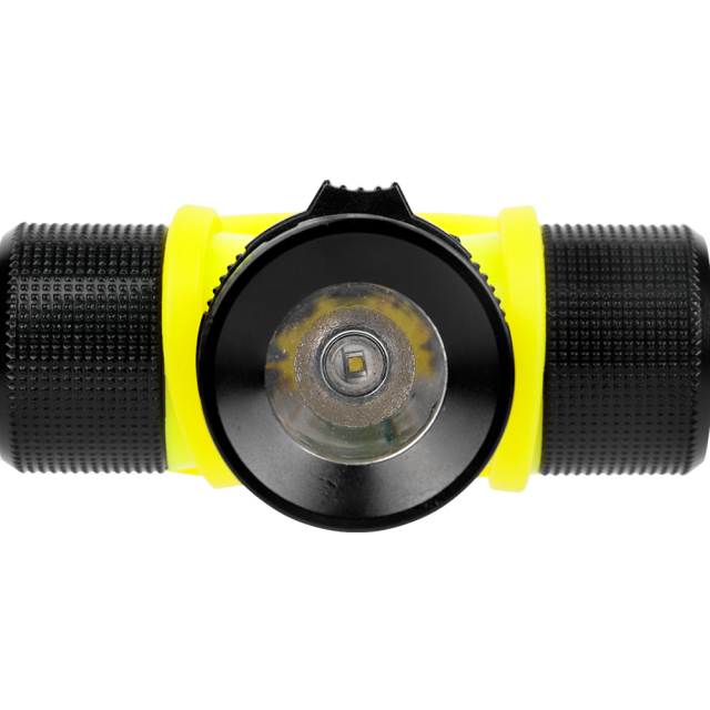 Detailed front close-up of the diving headlamp's central lens, textured metallic reflector, and black aluminum outer bezel.