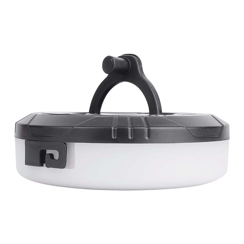 Side profile view of the round camping lantern flashlight, highlighting the low-profile two-tone body construction and a functional side notch.
