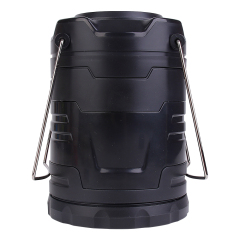 Direct front view of the collapsible LED camping lantern in its closed cylindrical form on a white background, featuring folded metal handles.