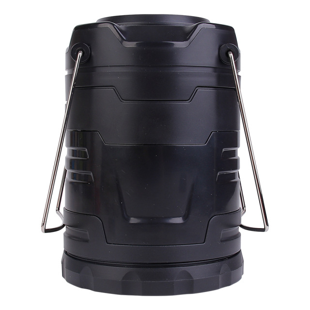 Direct front view of the collapsible LED camping lantern in its closed cylindrical form on a white background, featuring folded metal handles.