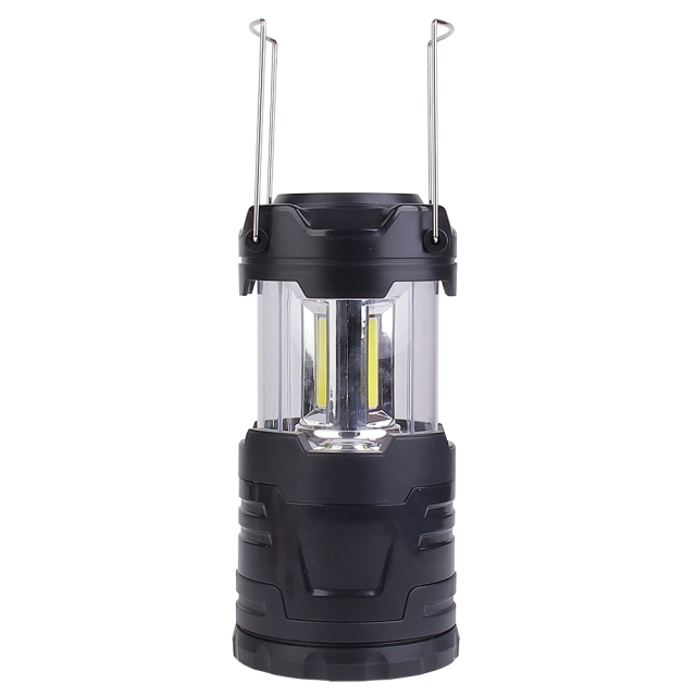 The opened collapsible LED camping lantern shown with its two stainless steel wire handles raised, highlighting the portability feature.