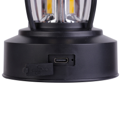 Close-up view of the base showing an opened rubber dust plug exposing the built-in USB Type-C input port for fast charging.