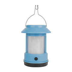 A light blue retro camping lantern on a white background with a metal hanger wire and a frosted protective light cover.