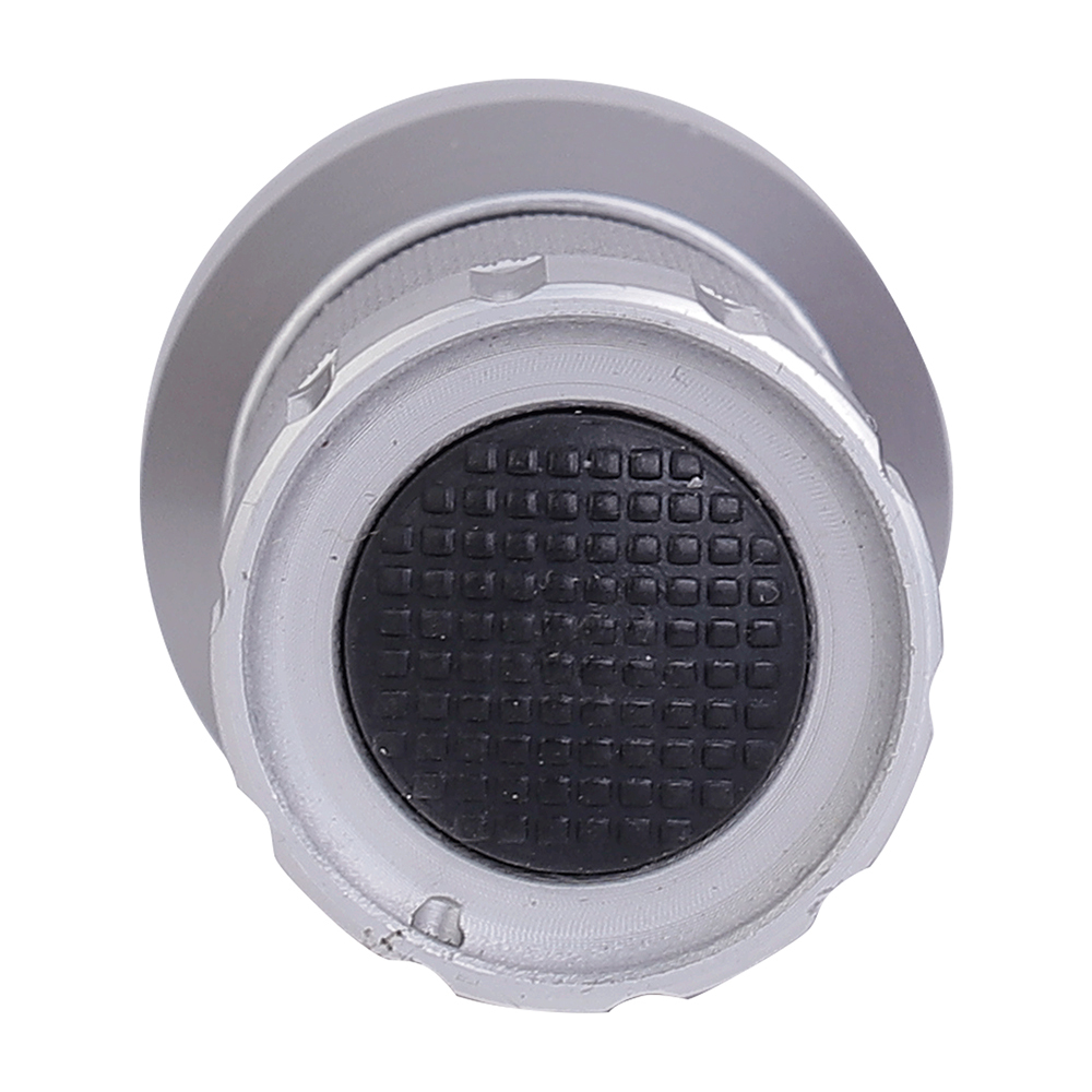 A bottom close-up view of the silver flashlight showing the black rubber push button switch on the tail cap.