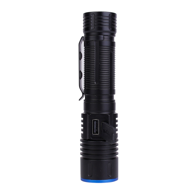 A close-up view of the tactical flashlight showing the rubber cover protecting the built-in USB Type-C charging port.