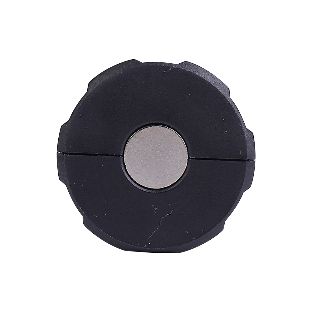 Bottom view of the mini flashlight displaying the strong circular magnet for hands-free mounting.