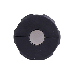 Bottom view of the mini flashlight displaying the strong circular magnet for hands-free mounting.