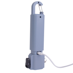 The multifunctional car emergency flashlight connected to a Type-C USB charging cable.