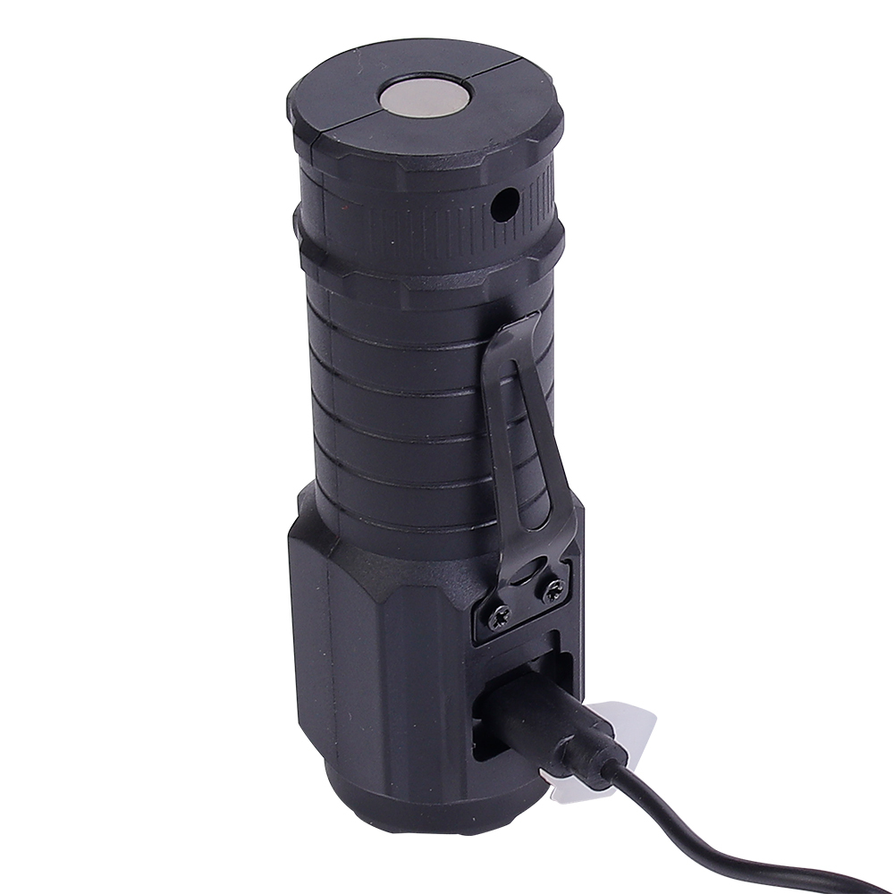 The black mini LED flashlight standing upright while connected to a Type-C USB charging cable.