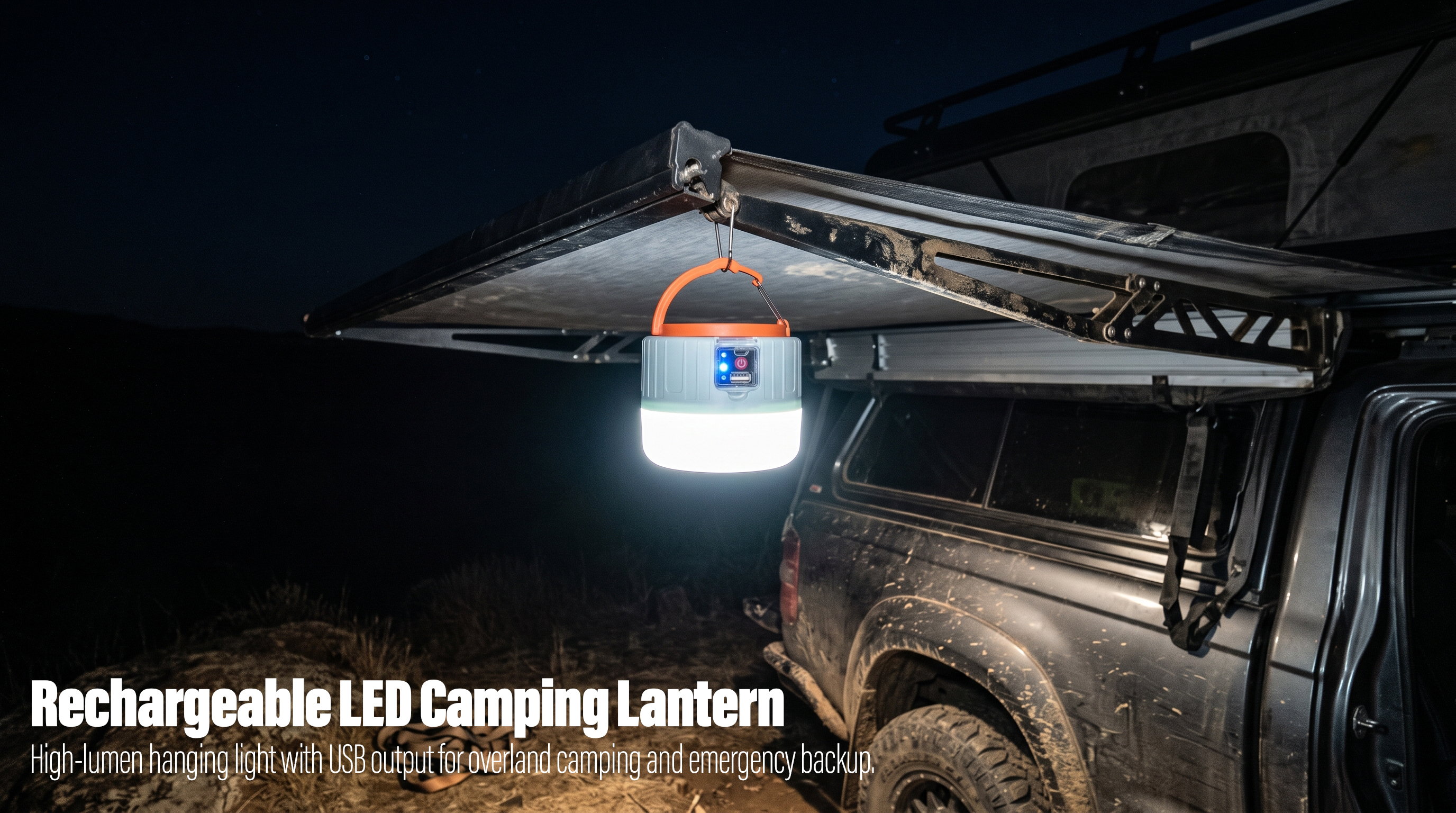 An orange and grey rechargeable LED camping lantern hanging from an off-road vehicle awning at night.