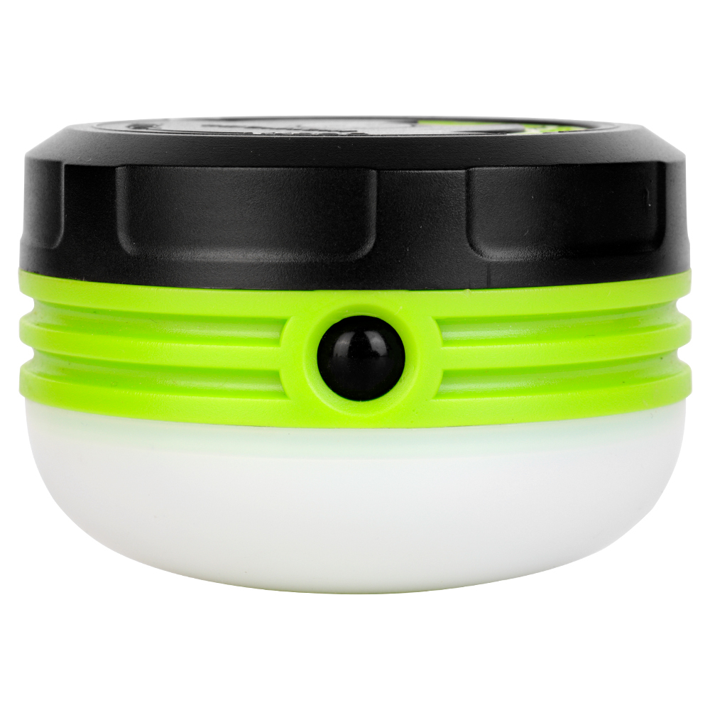 Side view of the green and black mini camping light with its handle folded down and showing the front power button.